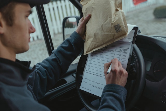 mail%20deliver%20person%20looking%20at%20an%20address%20on%20a%20form mail%20deliver%20person%20looking%20at%20an%20address%20on%20a%20form